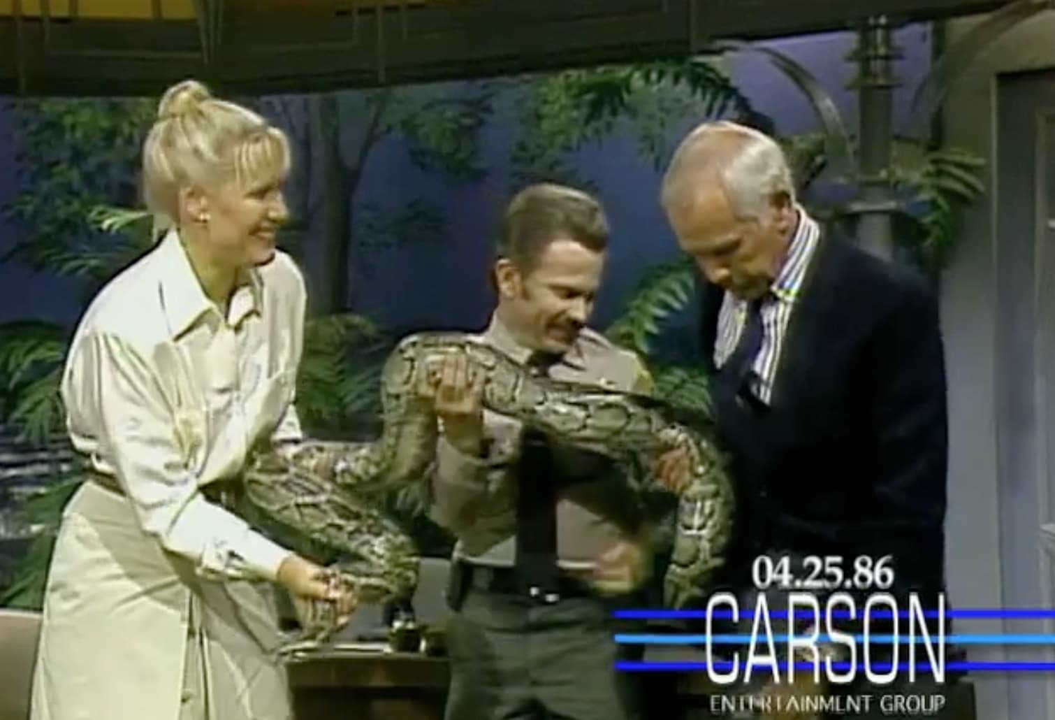 A Burmese Python gets a little too friendly with Johnny Carson. 